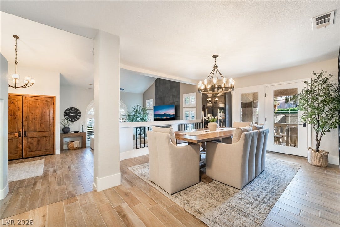 826 Rising Star Drive, Henderson, NV 89014 An open dining area flows seamlessly into the tiled entryway beneath high ceilings.