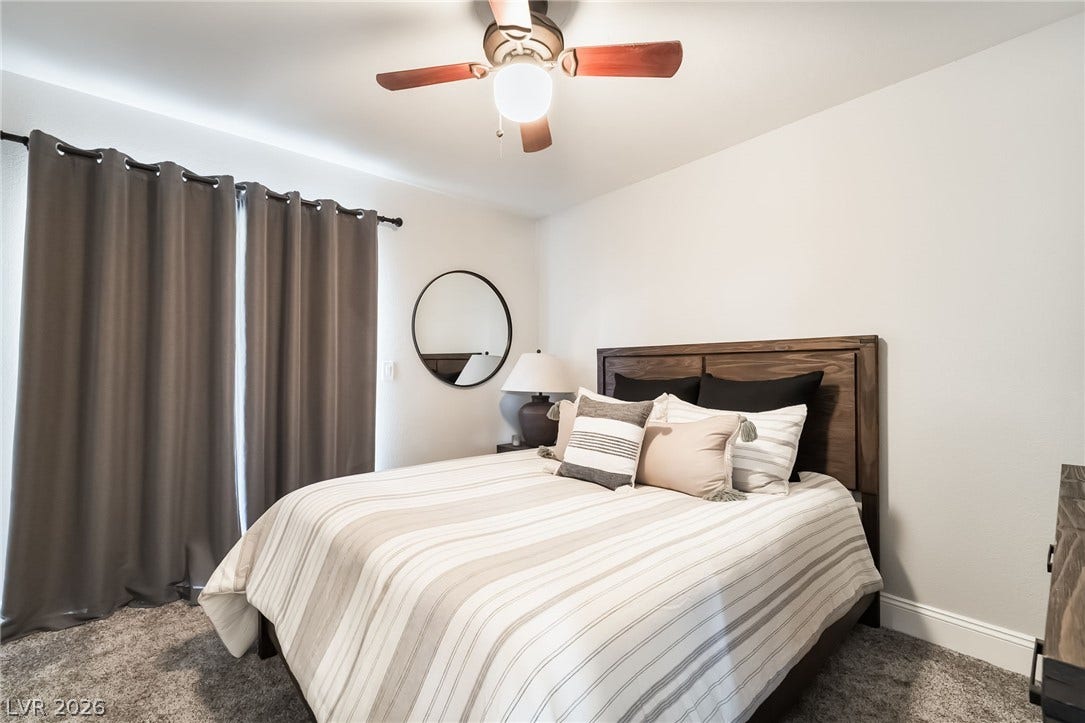 826 Rising Star Drive, Henderson, NV 89014 Plush carpeting and clean lines define this inviting bedroom space.