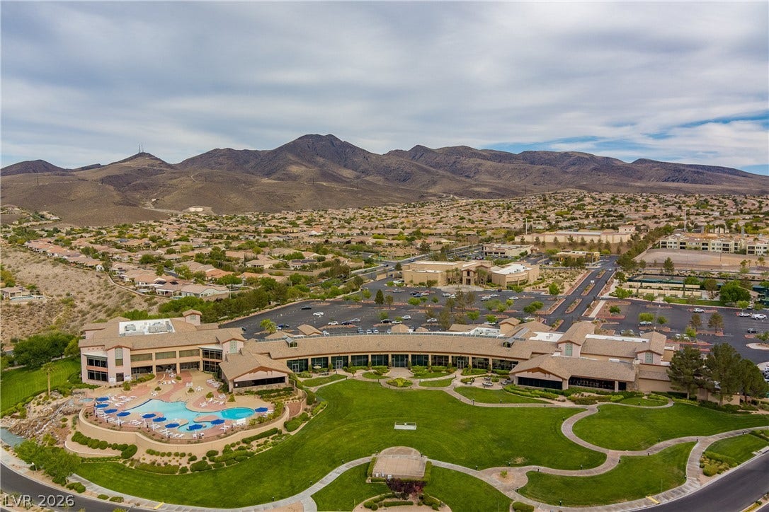 2247 Shadow Canyon Drive, Henderson, NV 89044 A spacious community clubhouse sits framed by rolling fairways and a dramatic mountain backdrop.