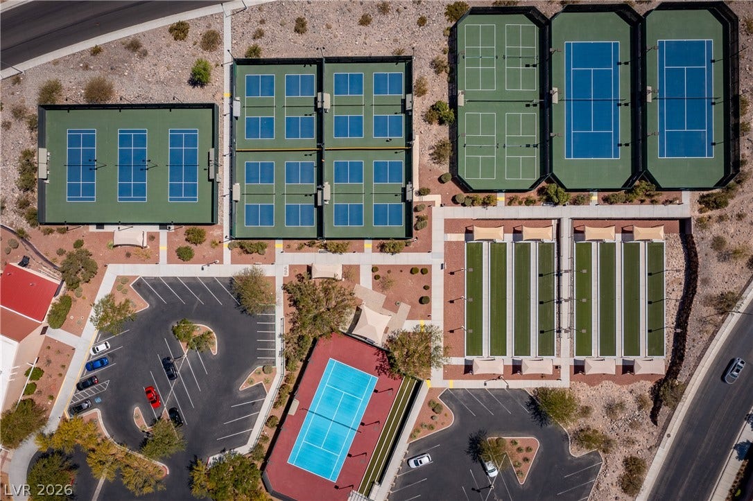 2247 Shadow Canyon Drive, Henderson, NV 89044 An aerial perspective showcases an impressive array of neighborhood recreational courts and parking facilities.