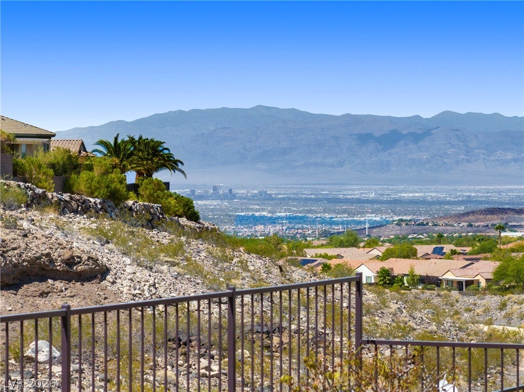 2247 Shadow Canyon Drive, Henderson, NV 89044 Distant mountain ranges and city lights frame this elevated desert property vantage point.