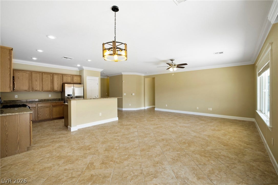 2247 Shadow Canyon Drive, Henderson, NV 89044 Granite counters and tile flooring accent this open living area.