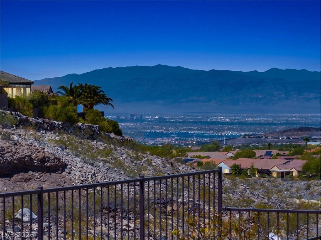 2247 Shadow Canyon Drive, Henderson, NV 89044 Breathtaking mountain and city light vistas unfold from this elevated hillside vantage point.