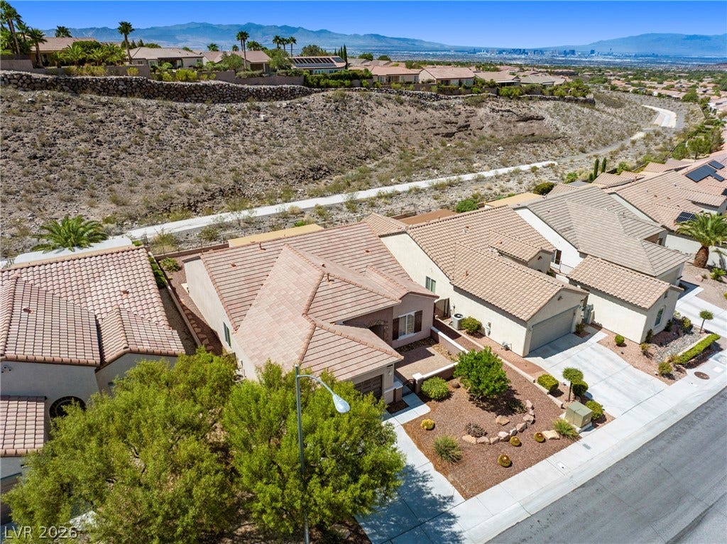 2247 Shadow Canyon Drive, Henderson, NV 89044 Elevated views showcase the tiled roofs, desert landscaping, and distant mountain skyline surrounding this property.