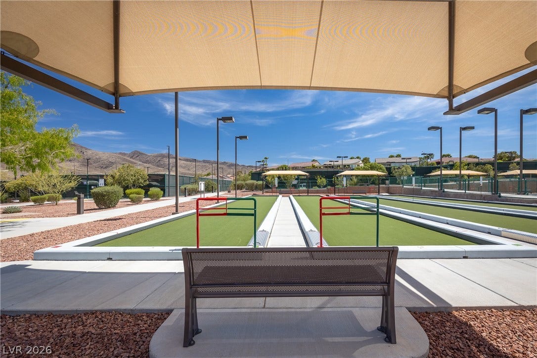 2247 Shadow Canyon Drive, Henderson, NV 89044 Shaded viewing areas overlook manicured courts set against a scenic desert mountain backdrop.