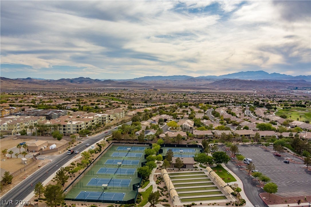 2247 Shadow Canyon Drive, Henderson, NV 89044 An aerial perspective showcases community sports courts against a sweeping backdrop of desert mountains.