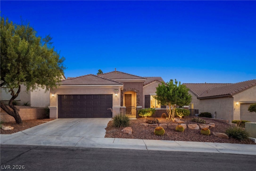 2247 Shadow Canyon Drive, Henderson, NV 89044 Desert landscaping and a tiled roof enhance the exterior of this single-level home.