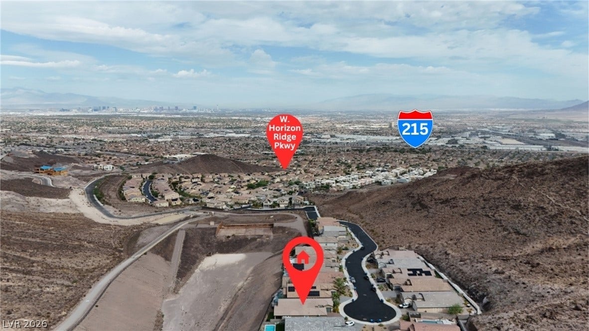 Panoramic valley vistas stretch across the horizon from this elevated hillside neighborhood location.