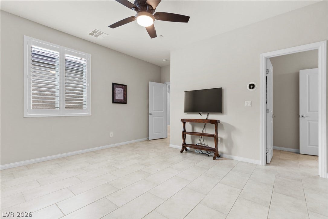 Gleaming tile floors and clean architectural lines define this versatile modern living area.