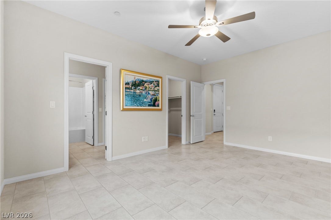 Durable tile flooring runs throughout this versatile space leading to adjacent rooms.