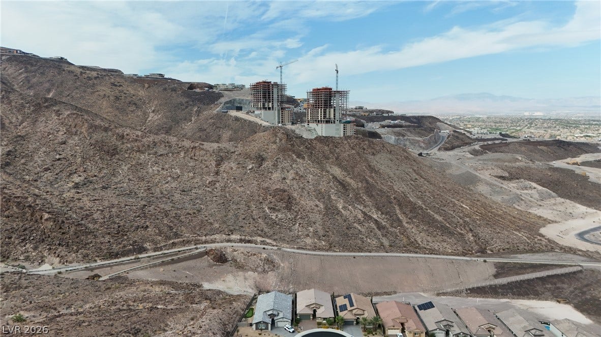Rugged hillsides provide a dramatic natural backdrop for these elevated desert homesites.