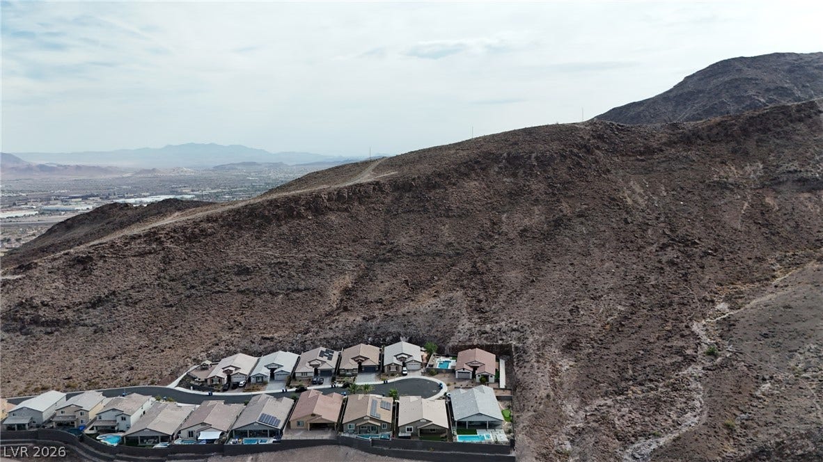 Rugged desert mountains rise directly behind this peaceful residential cul-de-sac.
