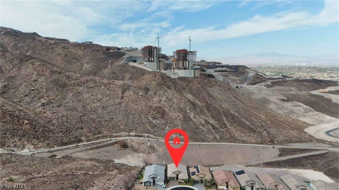 Dramatic mountain slopes frame this elevated neighborhood, offering sweeping desert and valley views.