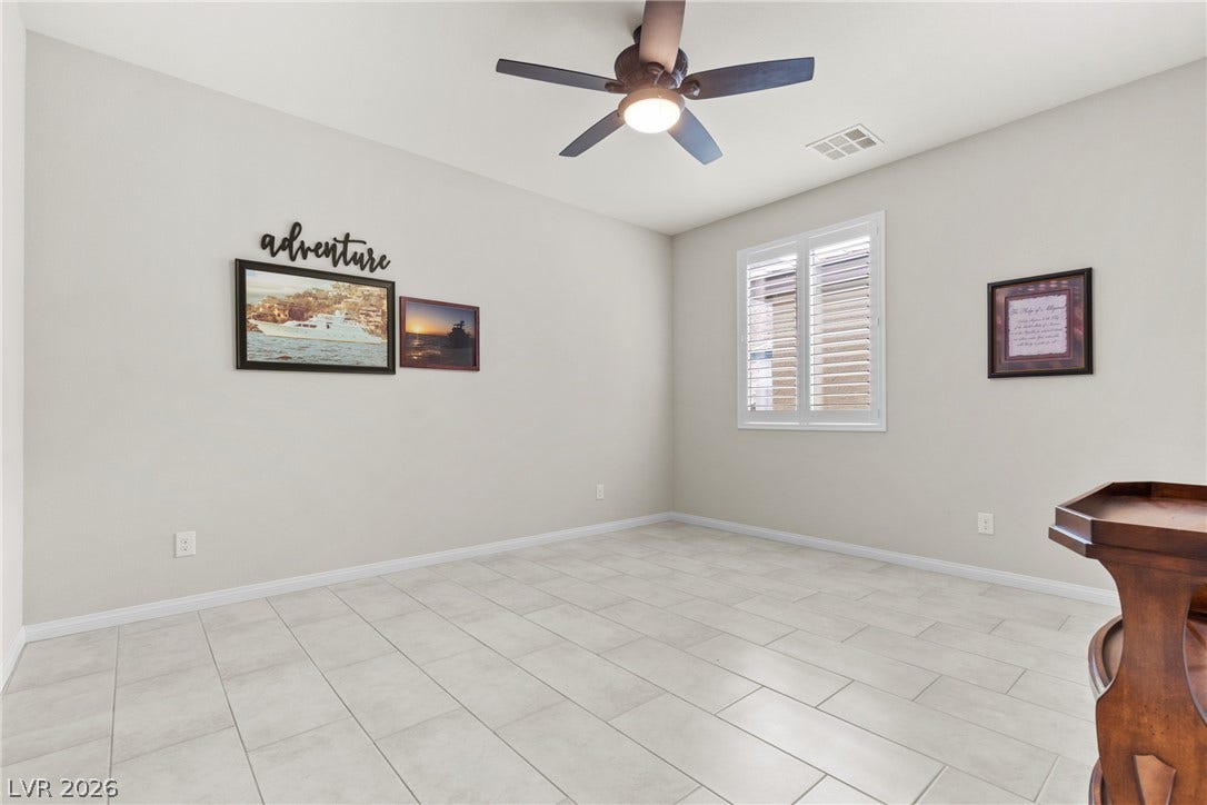 Tiled flooring and plantation shutters define this versatile secondary space.