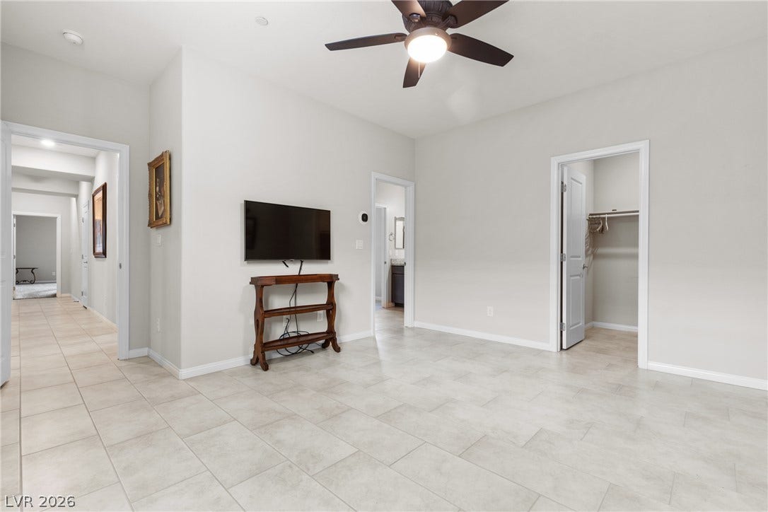 Plentiful natural light reflects beautifully across the durable tile floors in this bedroom.
