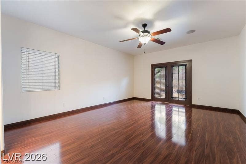 10605 Bardilino Street, Las Vegas, NV 89141 Polished hardwood floors and elegant French doors define this versatile, light-filled interior space.