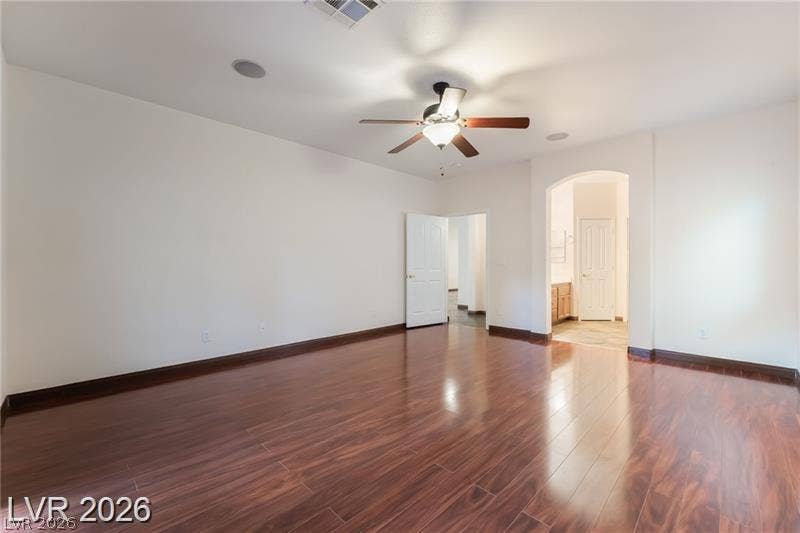 10605 Bardilino Street, Las Vegas, NV 89141 Rich wood-look flooring and tall ceilings elevate this versatile living space.