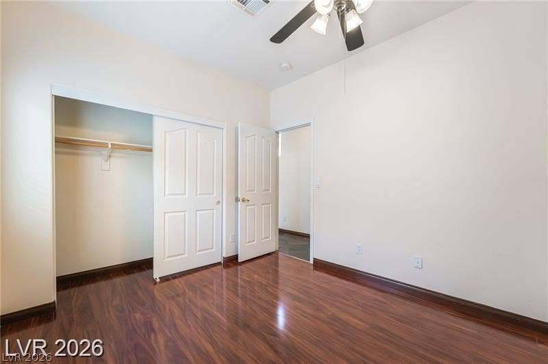 10605 Bardilino Street, Las Vegas, NV 89141 Rich wood flooring anchors this versatile bedroom complete with a generous closet system.