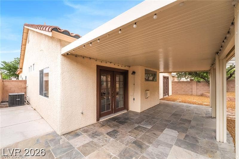10605 Bardilino Street, Las Vegas, NV 89141 An expansive covered patio features slate tile flooring and opens to the backyard.