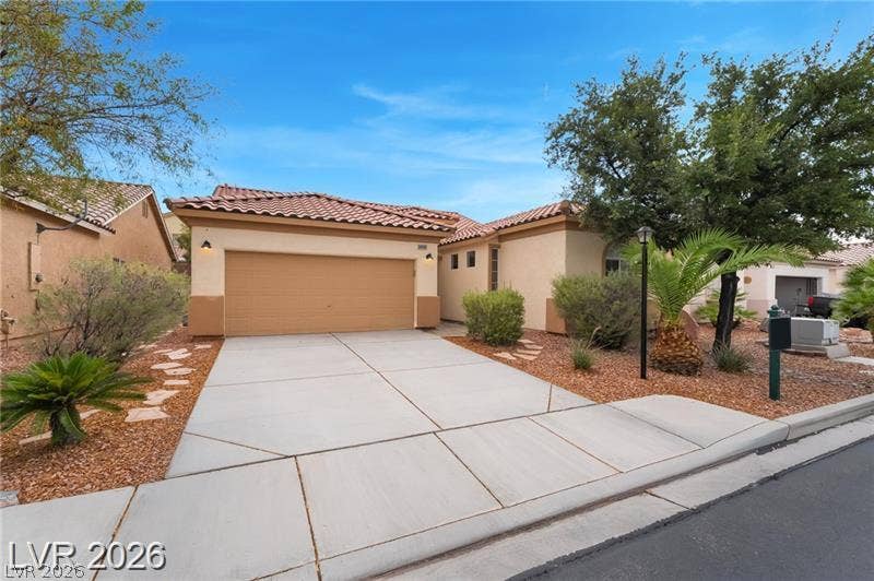 10605 Bardilino Street, Las Vegas, NV 89141 Clay tile roofing and stucco exterior walls define this classic desert home.