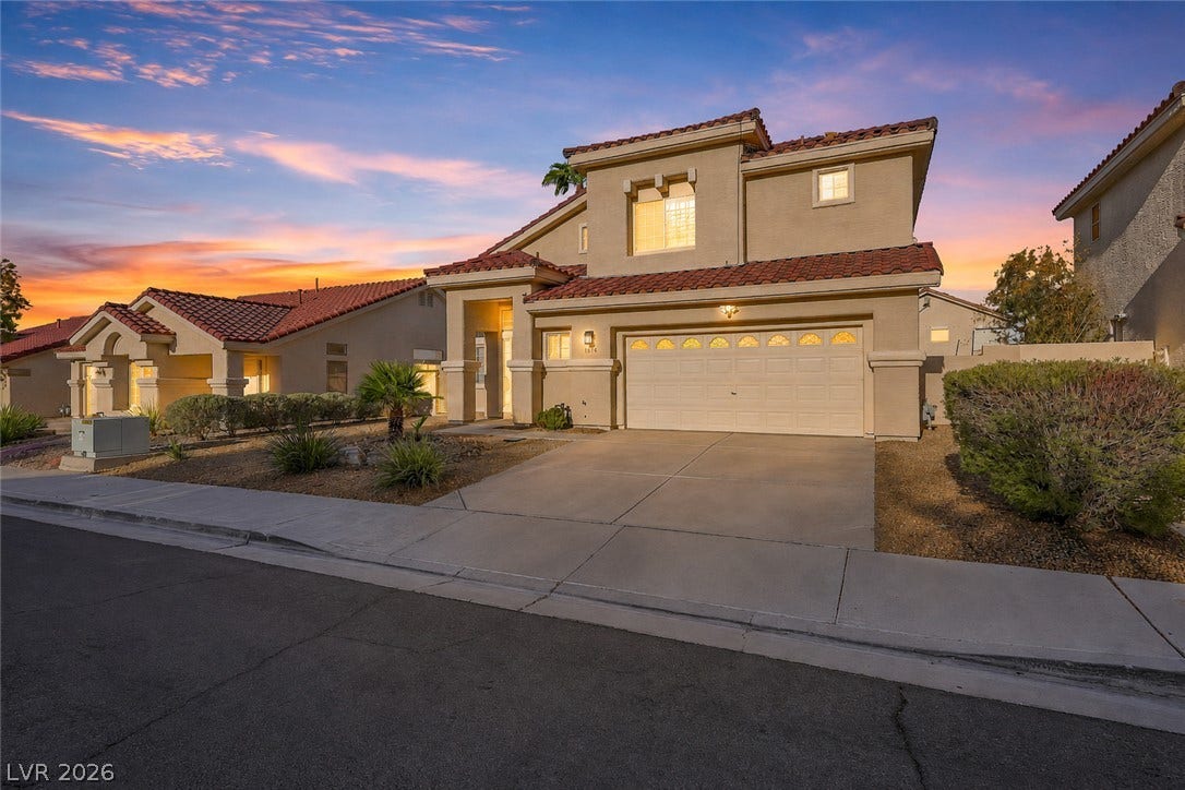 1874 Mesquite Canyon Drive, Henderson, NV 89012 Stucco exterior walls paired with a tile roof define this two-story residential design.
