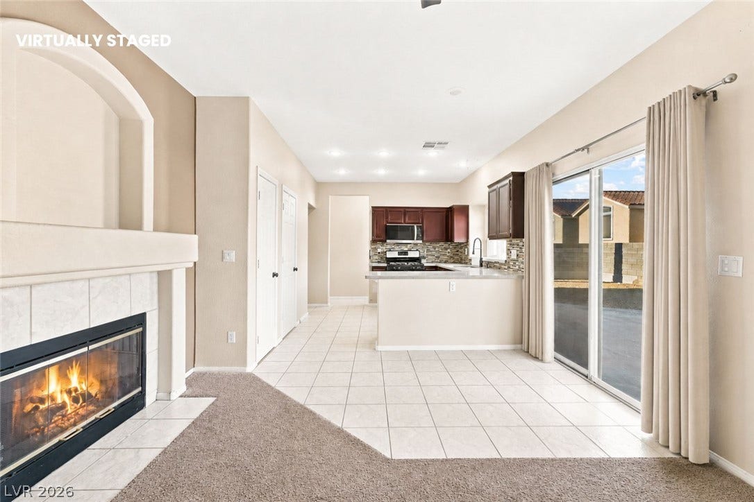 1874 Mesquite Canyon Drive, Henderson, NV 89012 An open floor plan seamlessly connects the fireplace-warmed living space to the adjacent kitchen.
