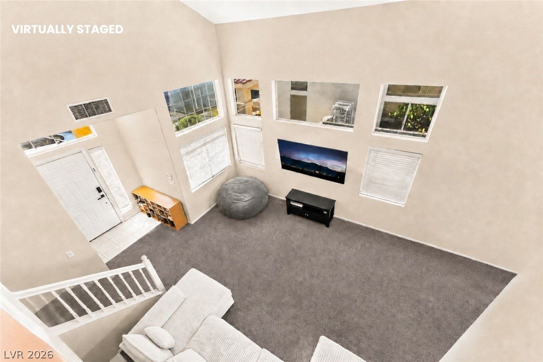 1874 Mesquite Canyon Drive, Henderson, NV 89012 High ceilings and tall windows bring immense volume to this open living space.