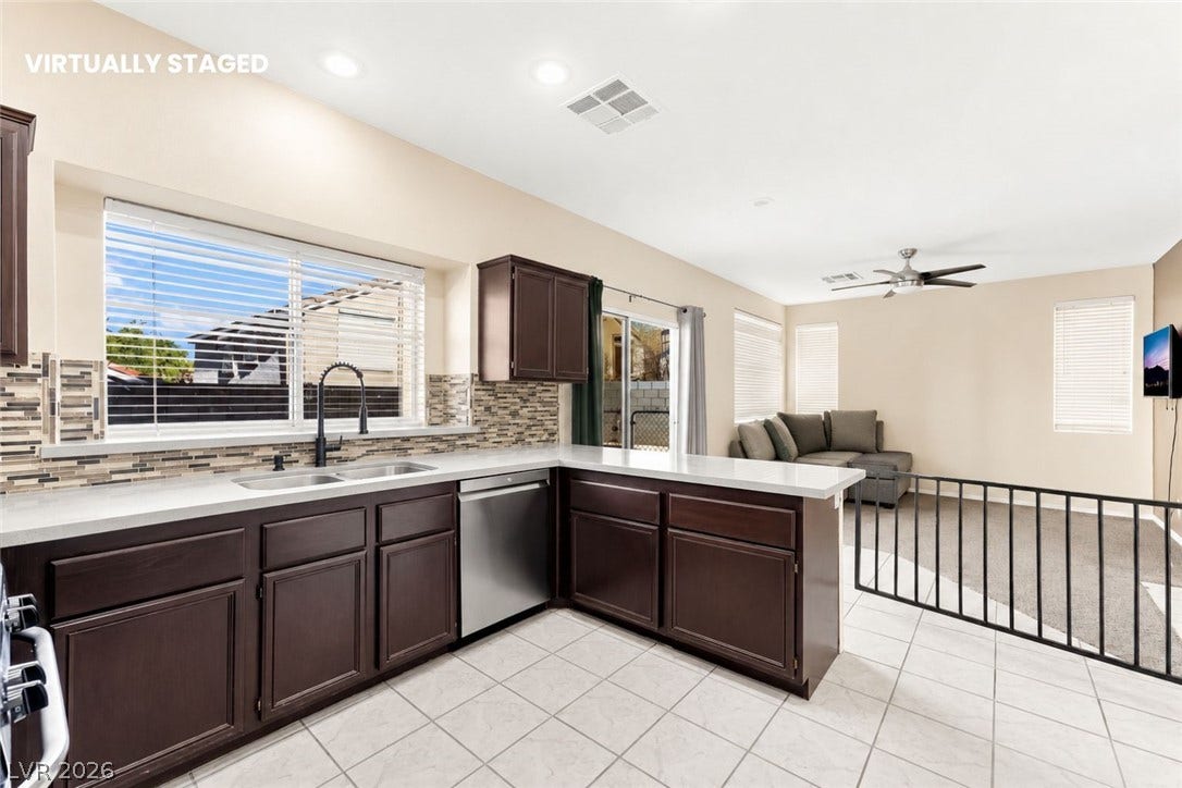 1874 Mesquite Canyon Drive, Henderson, NV 89012 An open floorplan seamlessly connects the functional kitchen space to an adjacent living area.