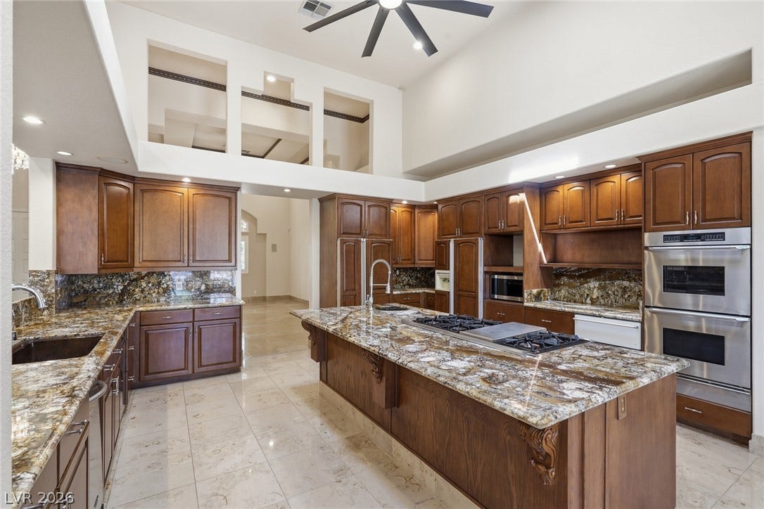 2212 Chatsworth Court, Henderson, NV 89074 Culinary aspirations come alive in this kitchen, featuring soaring ceilings and a spacious central island.