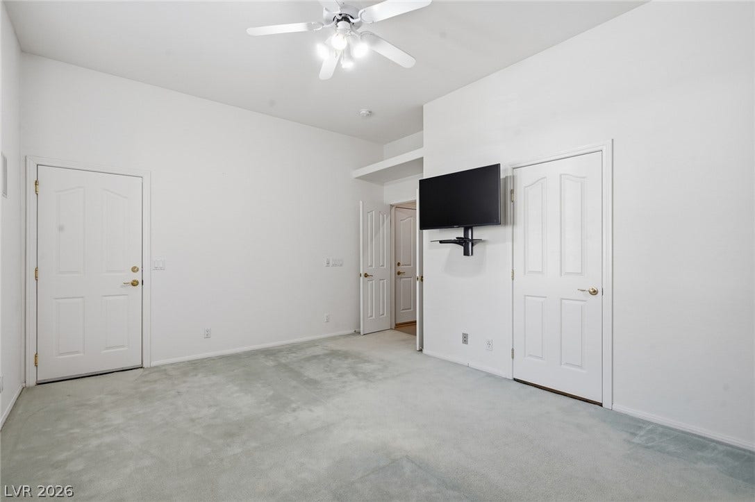 2212 Chatsworth Court, Henderson, NV 89074 A comfortable bedroom offering ample space and a refreshing ceiling fan.