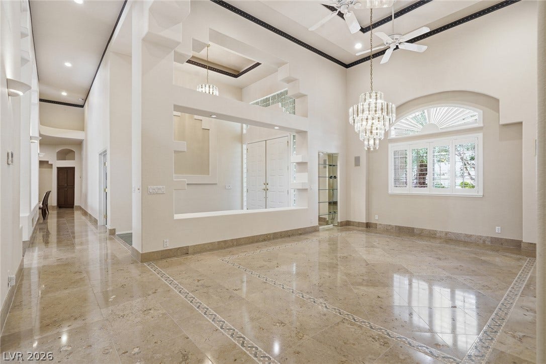 2212 Chatsworth Court, Henderson, NV 89074 Grand entryway with soaring ceilings and lustrous tile flooring creates an impressive welcome.