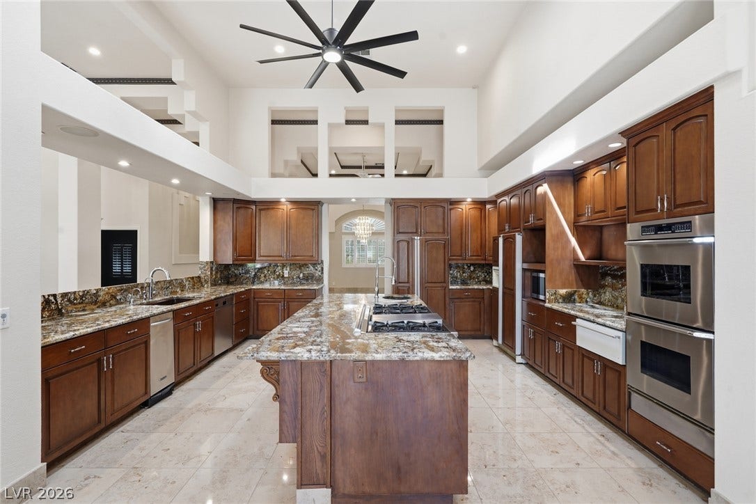 2212 Chatsworth Court, Henderson, NV 89074 Culinary delights await in this high-ceilinged kitchen, complete with a generous island and ample counter space.