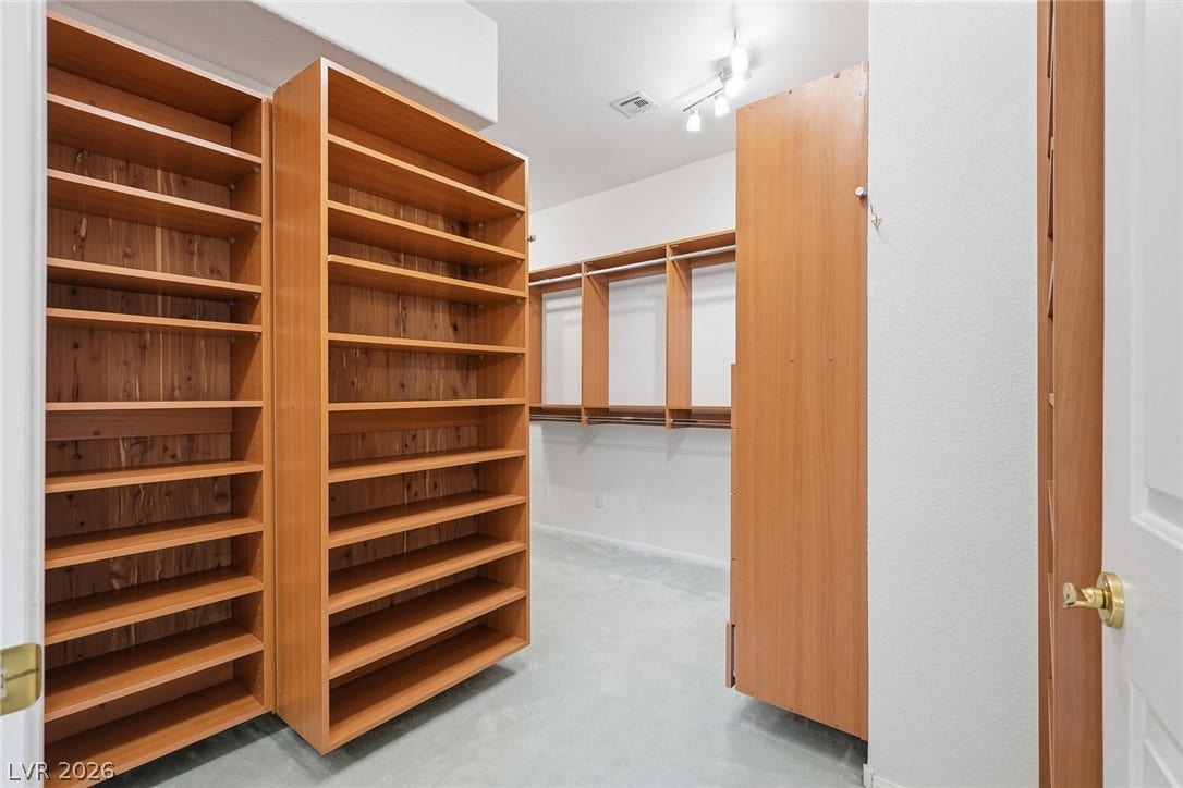 2212 Chatsworth Court, Henderson, NV 89074 Ample shelving and hanging space define this thoughtfully designed walk-in closet.