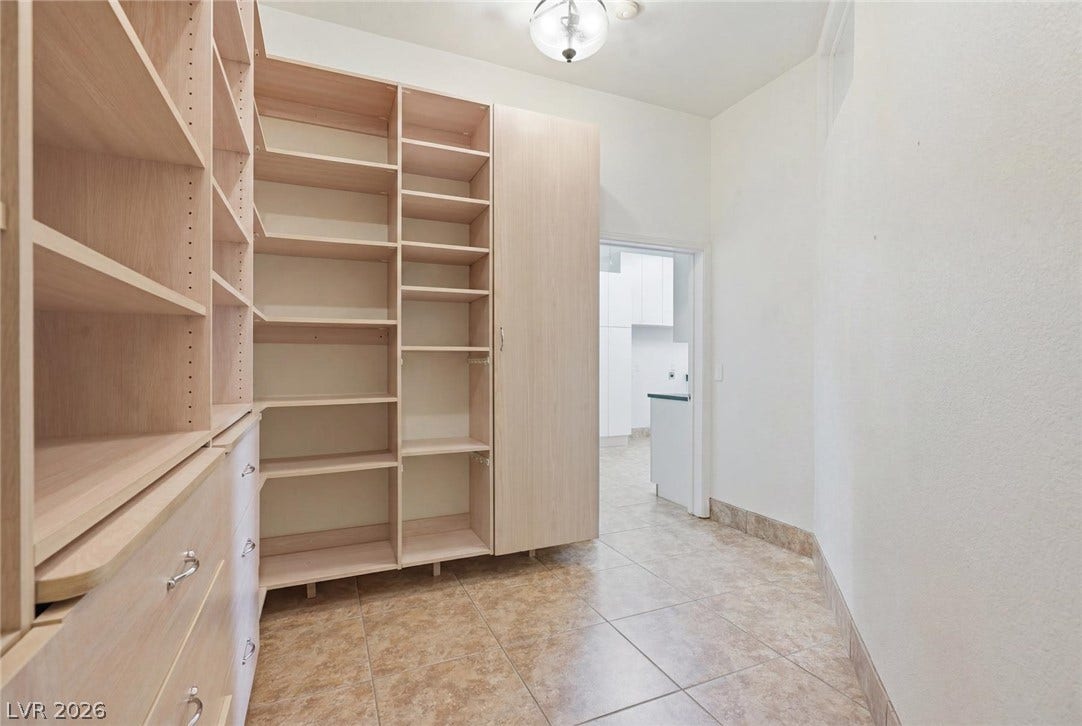 2212 Chatsworth Court, Henderson, NV 89074 Ample built-in shelving and drawers provide extensive storage space for an organized pantry.