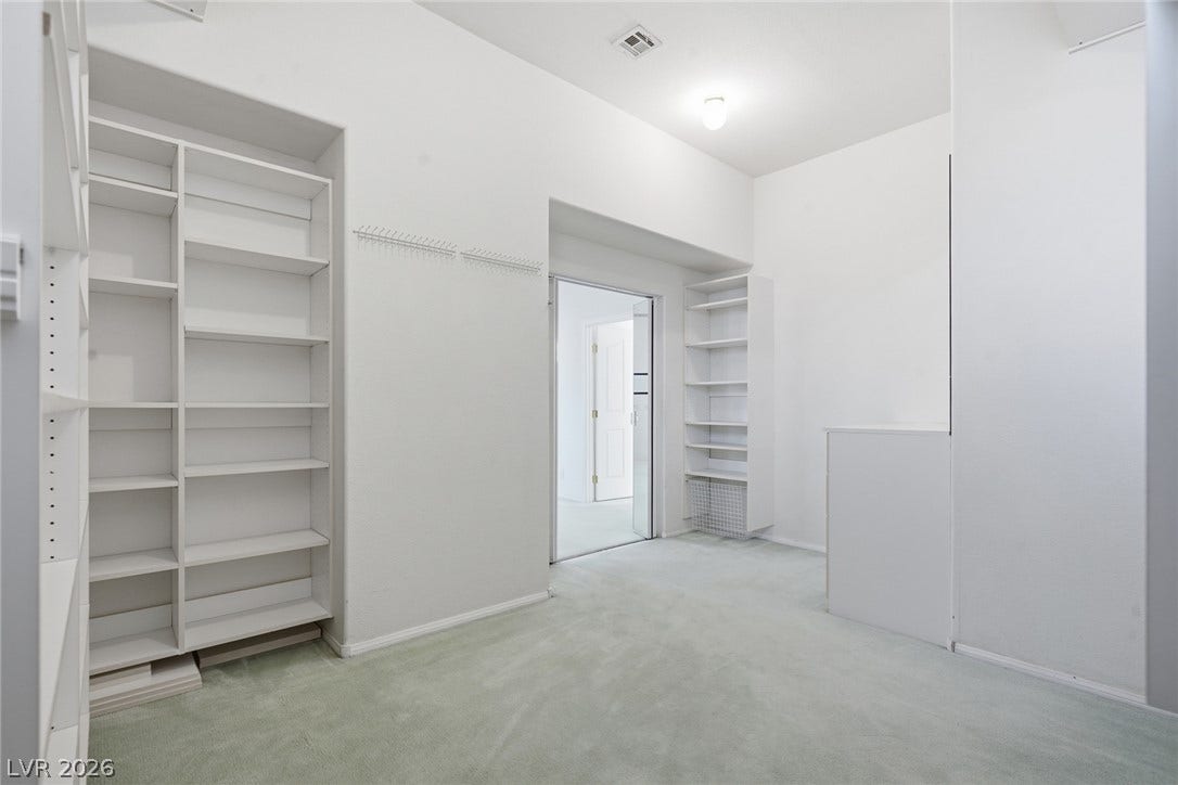 2212 Chatsworth Court, Henderson, NV 89074 Ample shelving and hanging space in this well-organized walk-in closet.