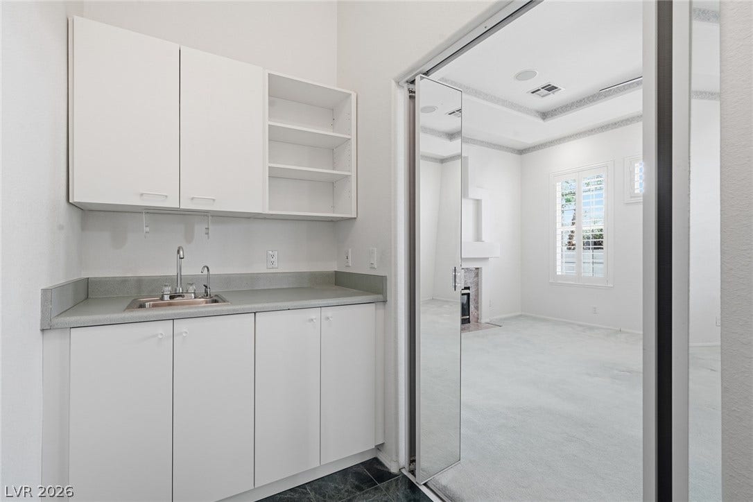 2212 Chatsworth Court, Henderson, NV 89074 A convenient wet bar adjoins this adaptable interior space, perfect for entertaining.
