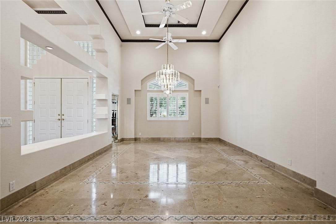 2212 Chatsworth Court, Henderson, NV 89074 Step into this grand entry, where soaring ceilings and elegant marble floors create a truly luxurious welcome.