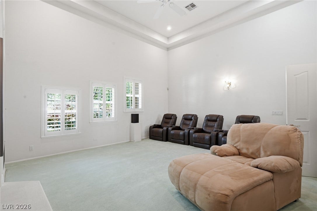 2212 Chatsworth Court, Henderson, NV 89074 A spacious recreation room featuring high ceilings and sun-filled windows.