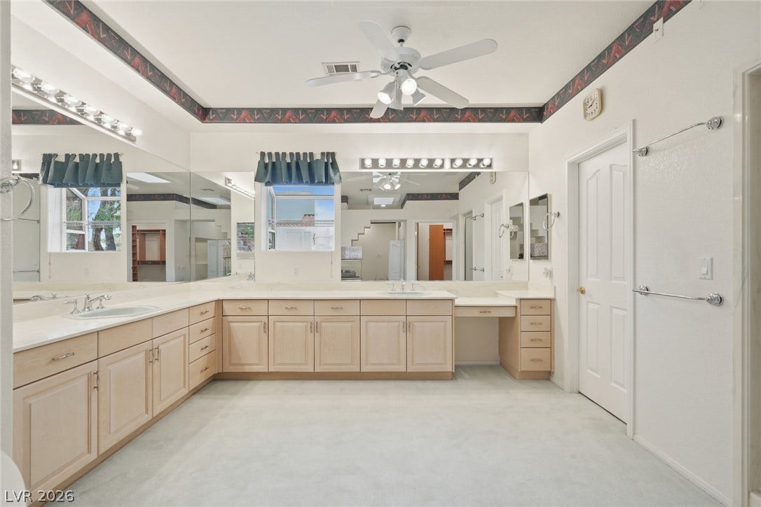 2212 Chatsworth Court, Henderson, NV 89074 Ample counter space and dual sinks create a functional and spacious primary bathroom.