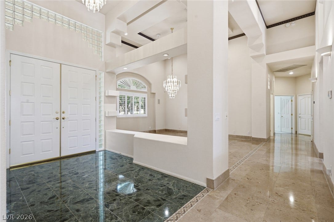 2212 Chatsworth Court, Henderson, NV 89074 Grand double doors open to a soaring entryway with elegant marble flooring.