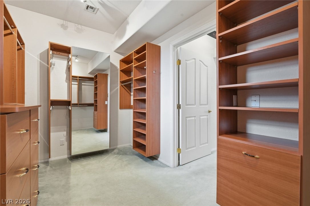 2212 Chatsworth Court, Henderson, NV 89074 Ample built-in storage solutions and thoughtful organization define this dedicated closet space.