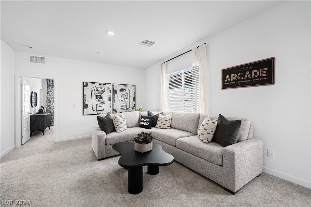 132 Harper Crest Avenue, Henderson, NV 89011 Recessed lighting, smooth walls, and plush carpeting define this versatile living space.