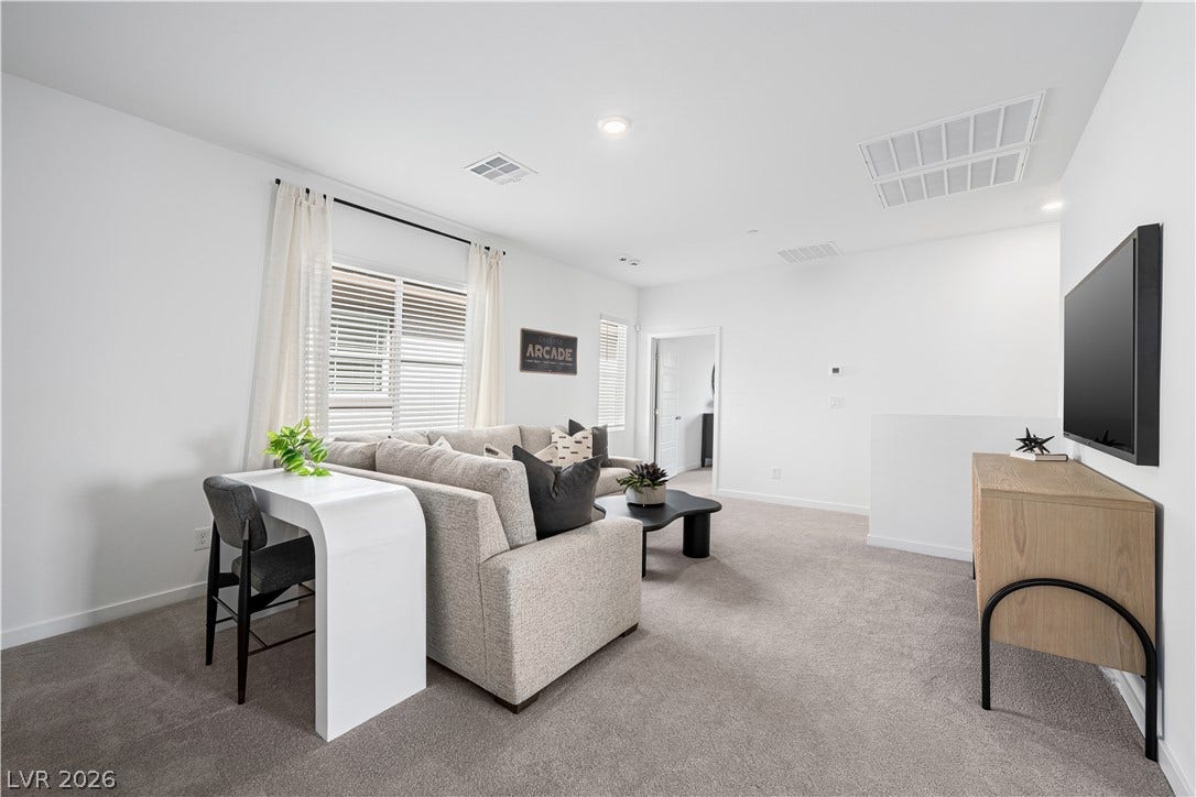 132 Harper Crest Avenue, Henderson, NV 89011 Plush carpeting and recessed lighting define this versatile second-floor loft space.
