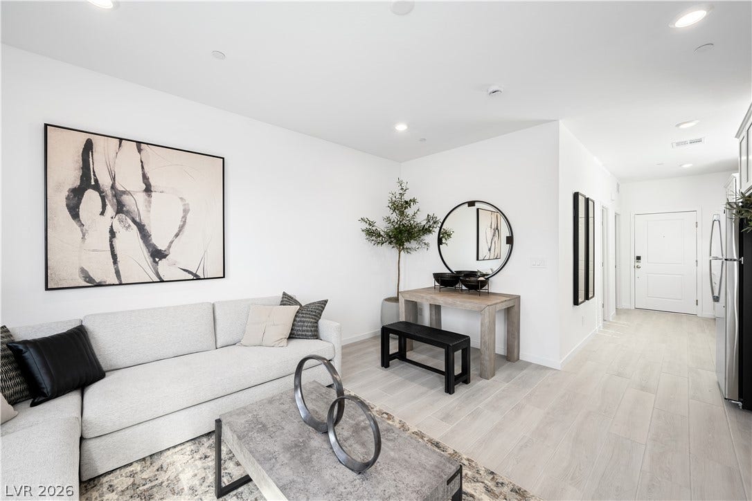 132 Harper Crest Avenue, Henderson, NV 89011 Recessed lighting illuminates this open living space featuring light wood-style flooring.