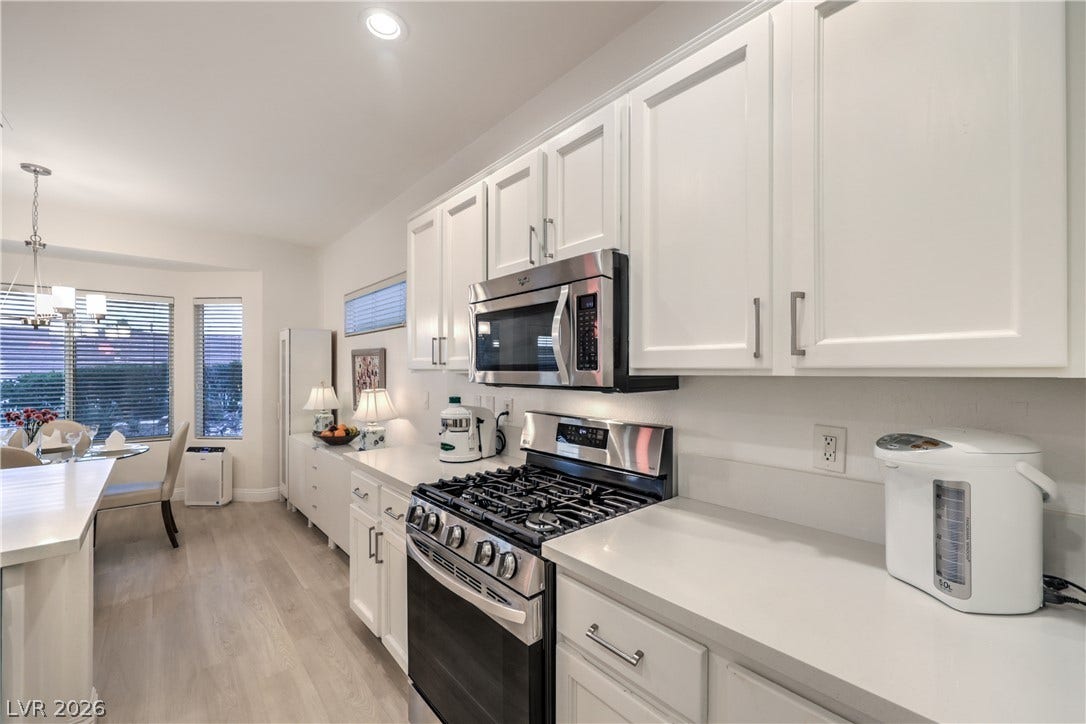 Kitchen boasts Quartz Countertops, Over Cabinet Lighting, Breakfast Bar, Nook w/ Bay Window, Recessed Lighting, Pendant Lights, Luxury Vinyl Plank Flooring, R/O System, and Stainless-Steel Gas Stove, Microwave, Refrigerator, and Dishwasher