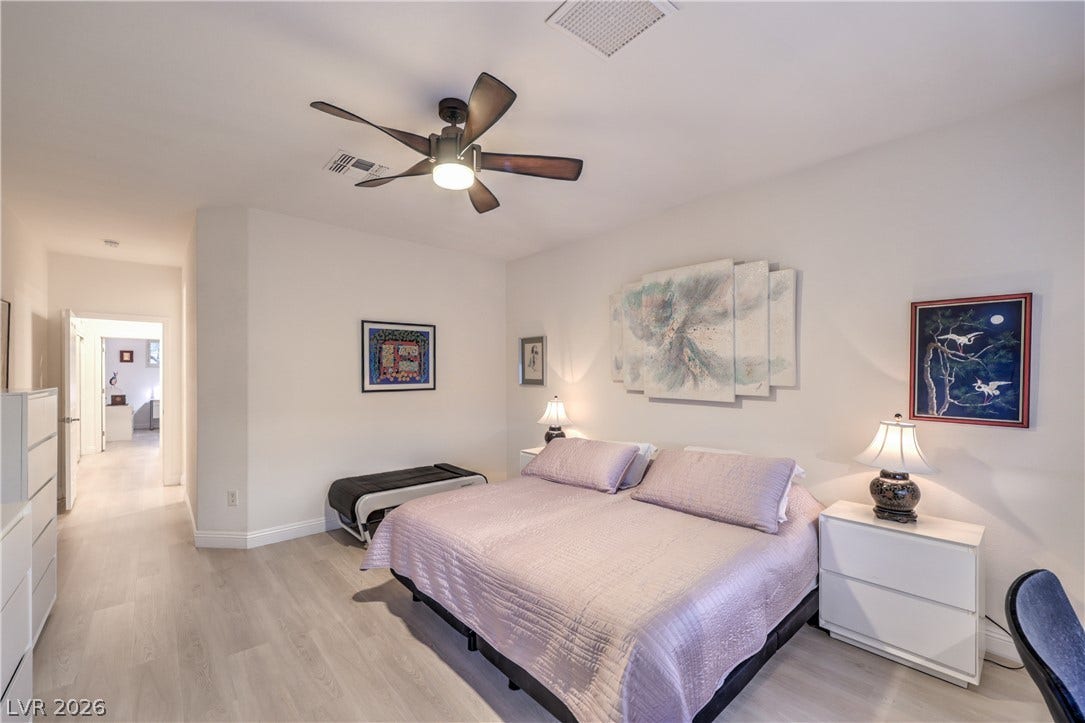 Owner's Suite with Bay Window, Ceiling Fan, Walk-In Closet w/ Organizers, and Bathroom with Raised Vanity, Dual Sinks, Shower w/ Seat, and Comfort Height Toilet w/ Bidet Heated Seat