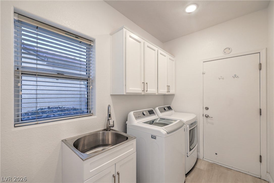 Laundry Room with Cabinets, Utility Sink, and Washer & Dryer