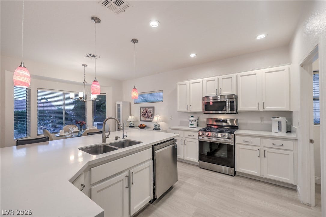 Kitchen boasts Quartz Countertops, Over Cabinet Lighting, Breakfast Bar, Nook w/ Bay Window, Recessed Lighting, Pendant Lights, Luxury Vinyl Plank Flooring, R/O System, and Stainless-Steel Gas Stove, Microwave, Refrigerator, and Dishwasher