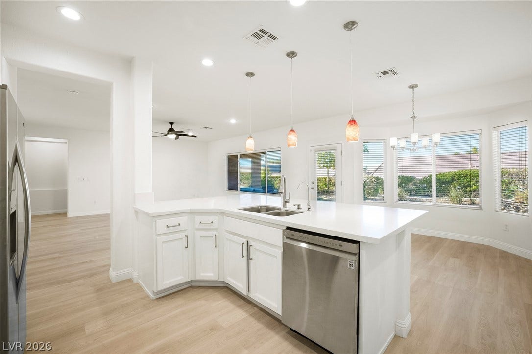 Kitchen boasts Quartz Countertops, Over Cabinet Lighting, Breakfast Bar, Nook w/ Bay Window, Recessed Lighting, Pendant Lights, Luxury Vinyl Plank Flooring, R/O System, and Stainless-Steel Gas Stove, Microwave, Refrigerator, and Dishwasher