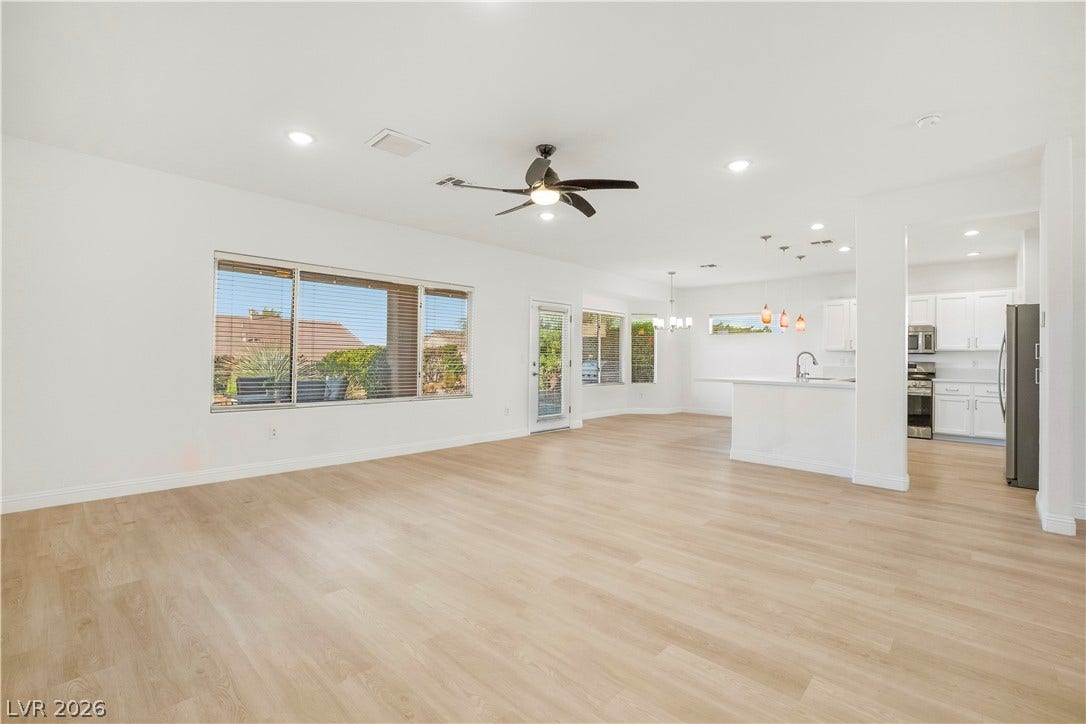 Spacious Great Room with Ceiling Fan and Recessed Lighting
